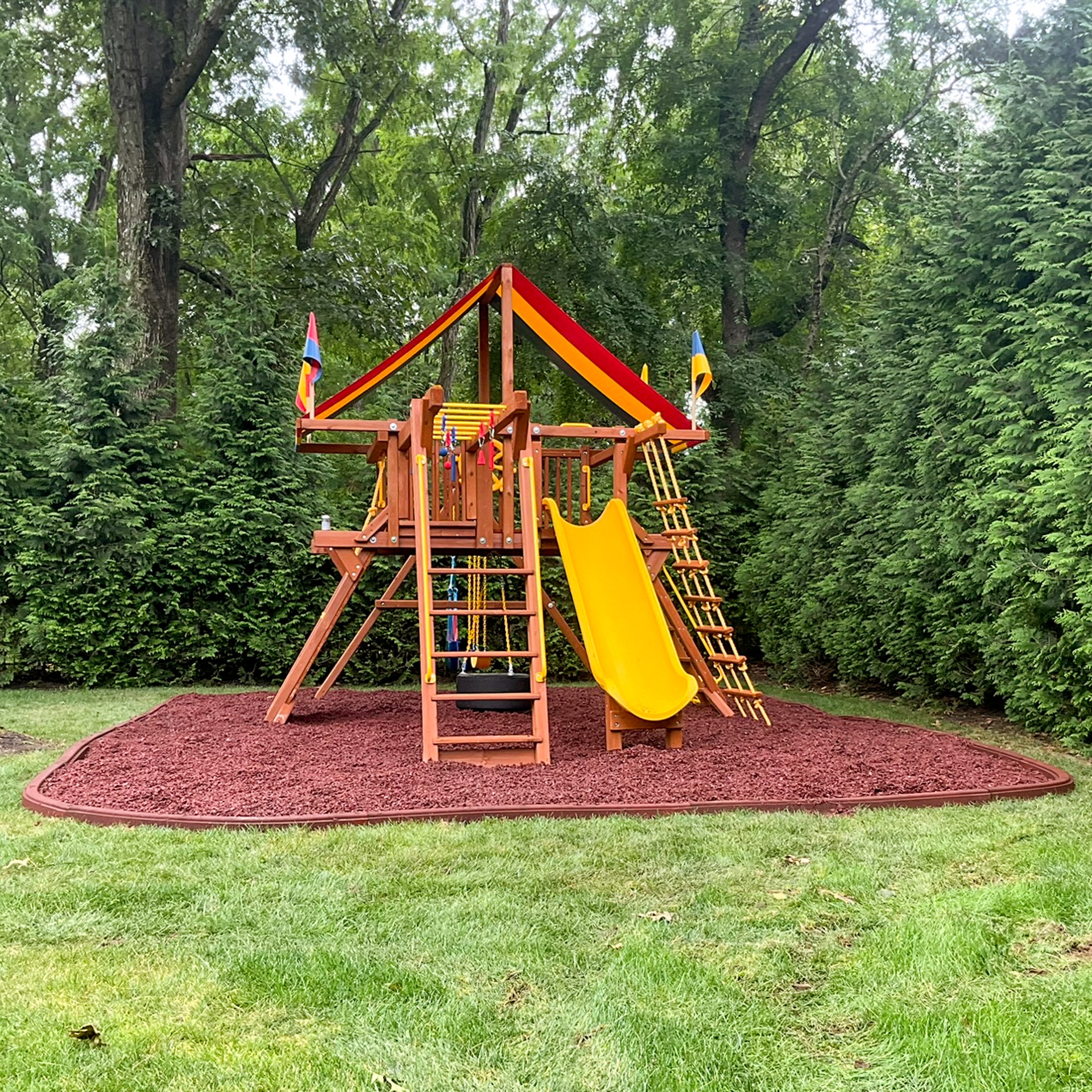 outside of a rubber mulch swingset base