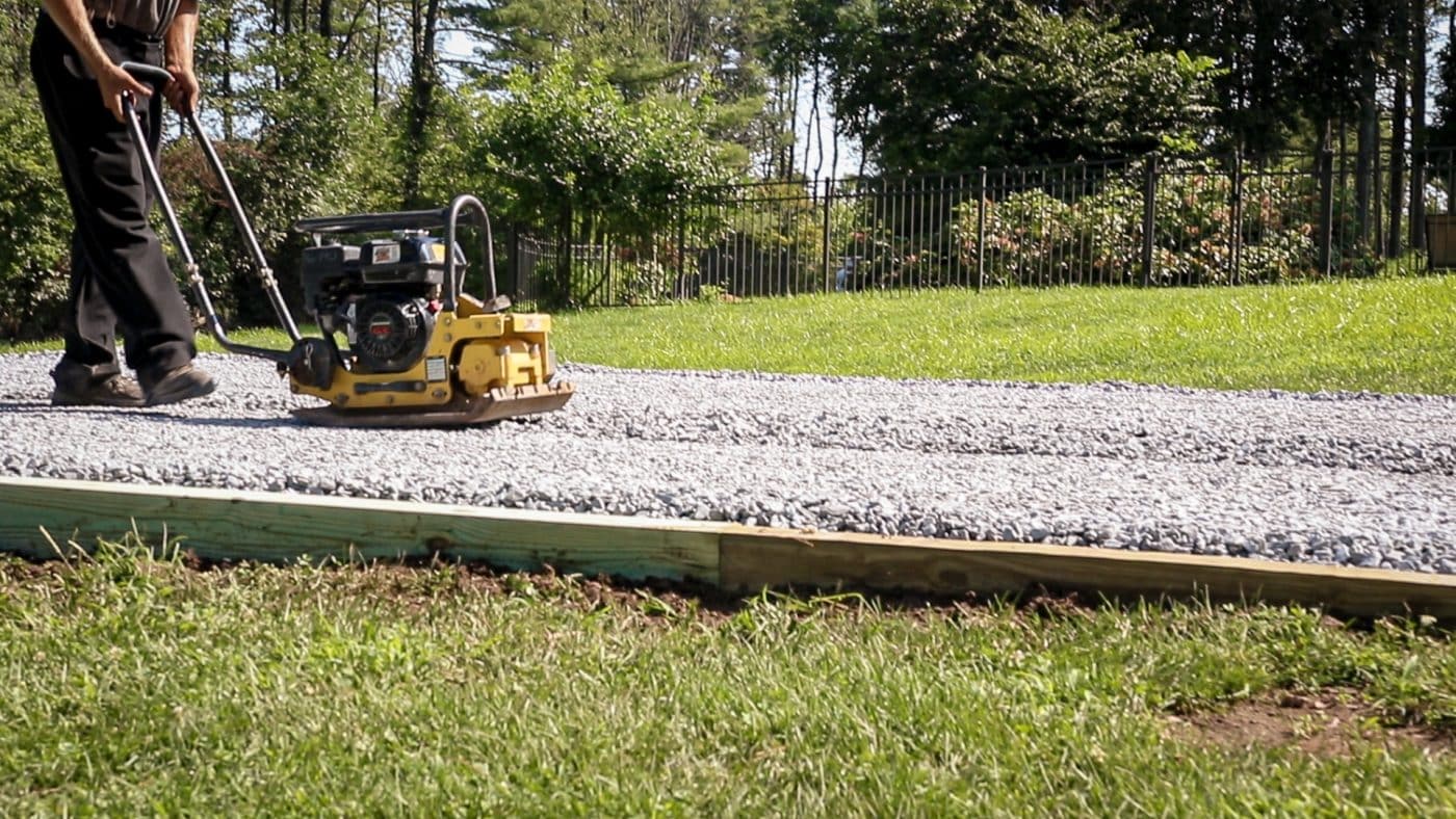 Compacting a gravel shed foundation in Delaware