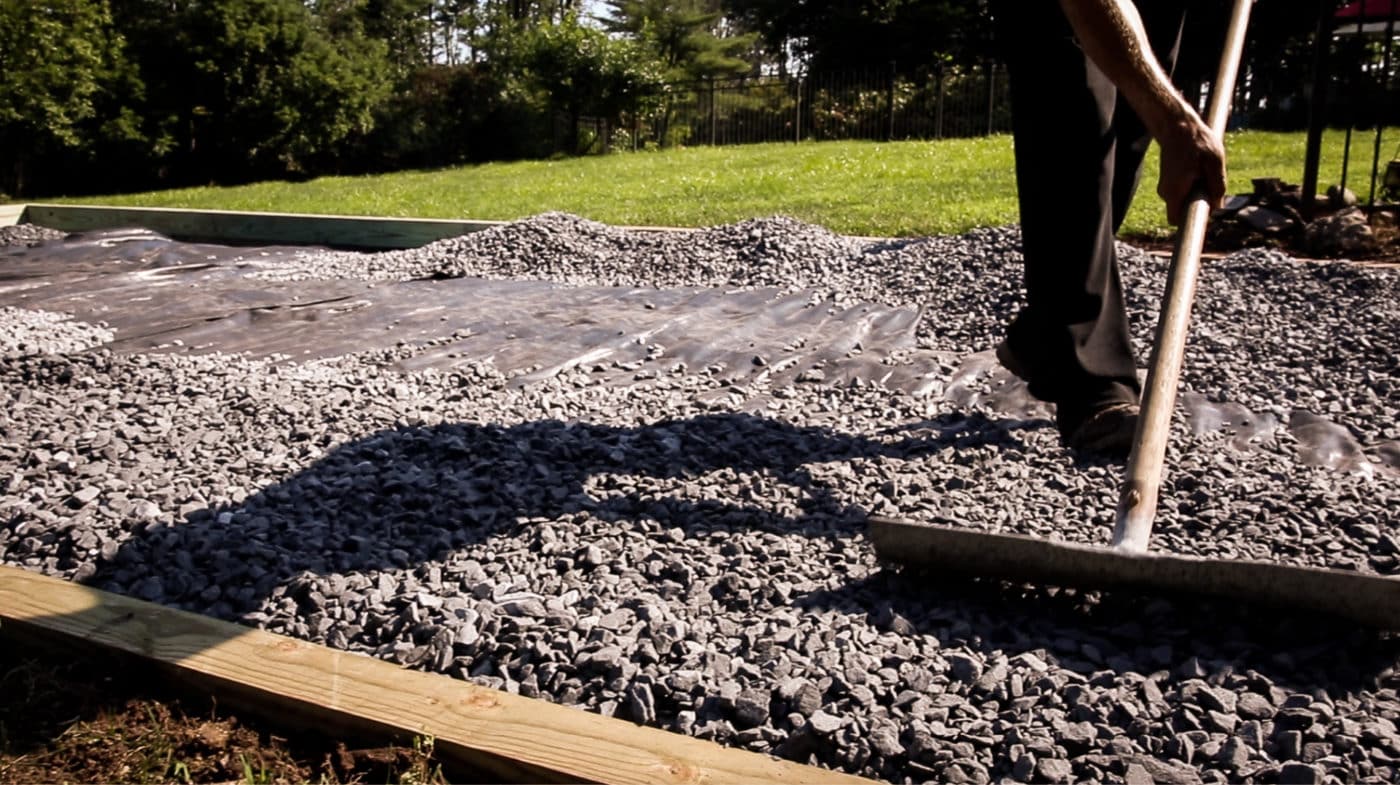 Spreading stone for a gravel shed foundation in New Jersey