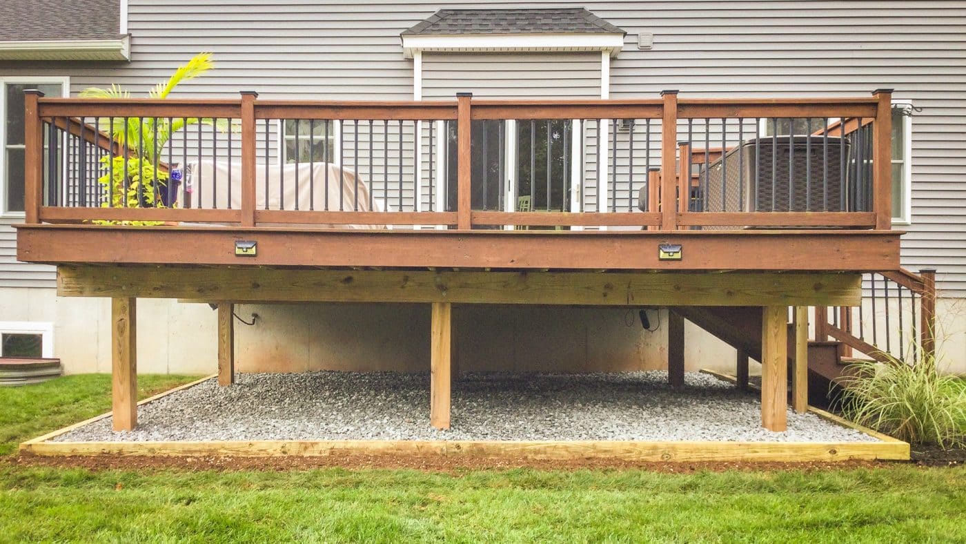 A gravel area under a deck