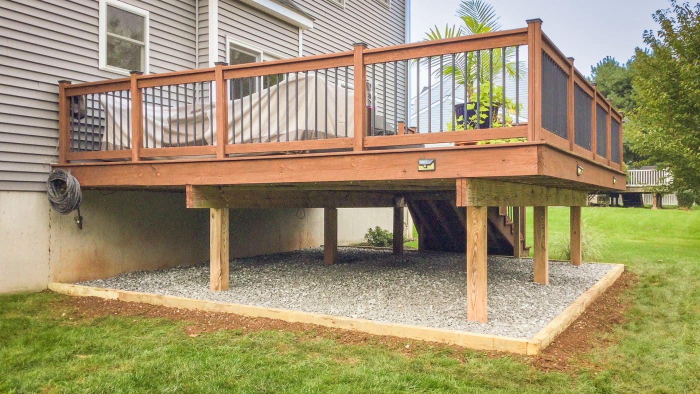 A gravel pad under a deck