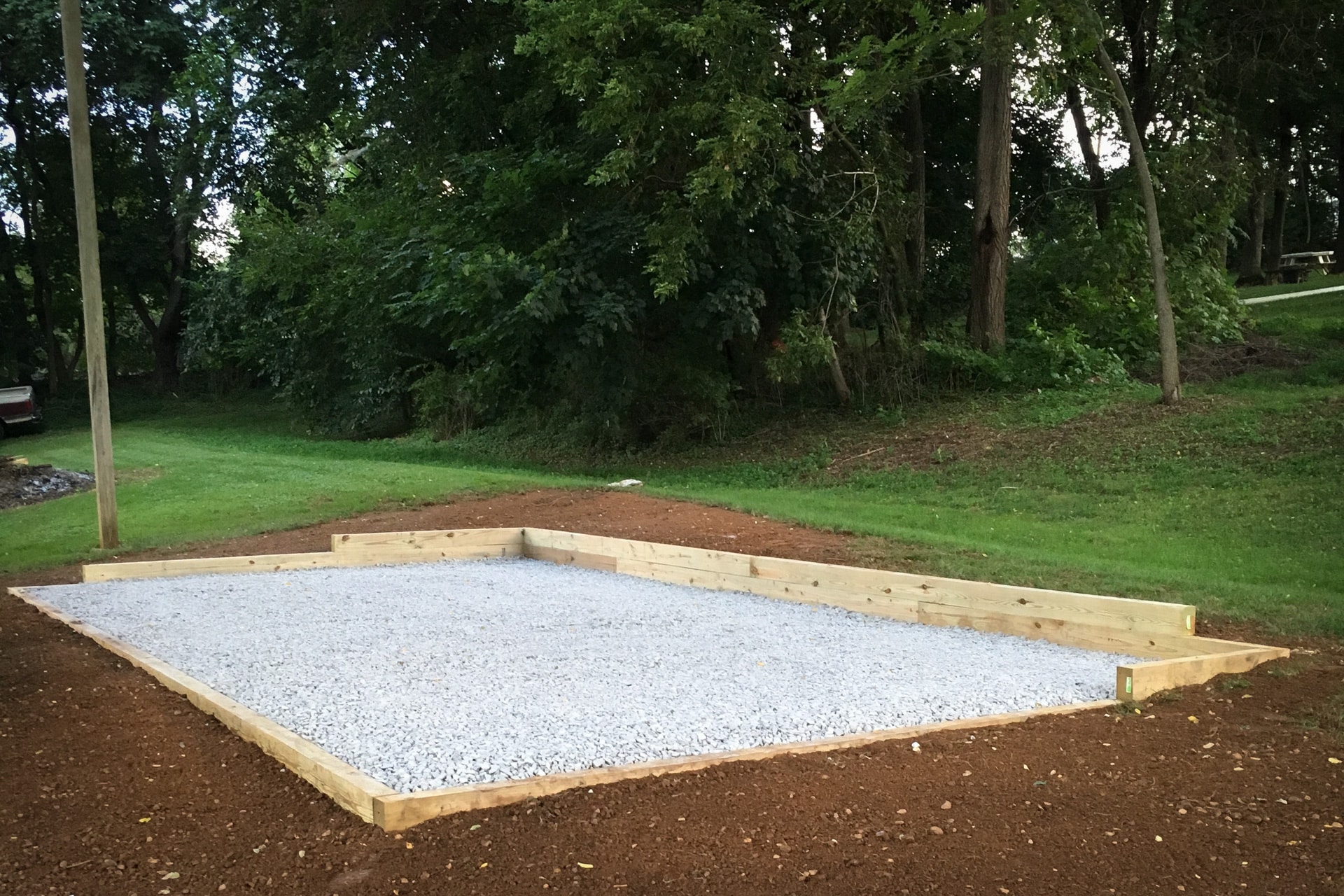 Gravel ground preparation for a shed on a slope