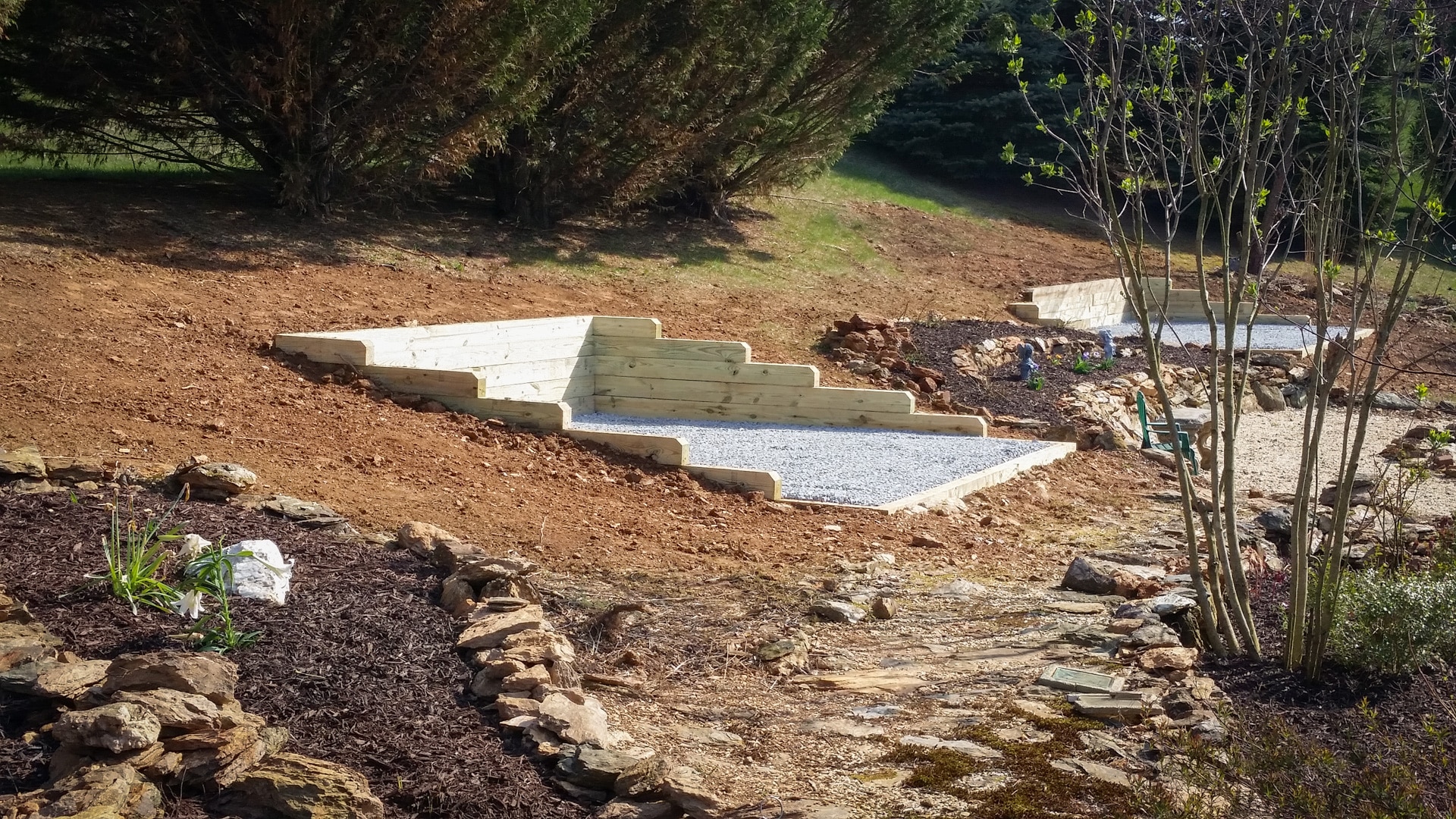 A gravel shed pad on a slope