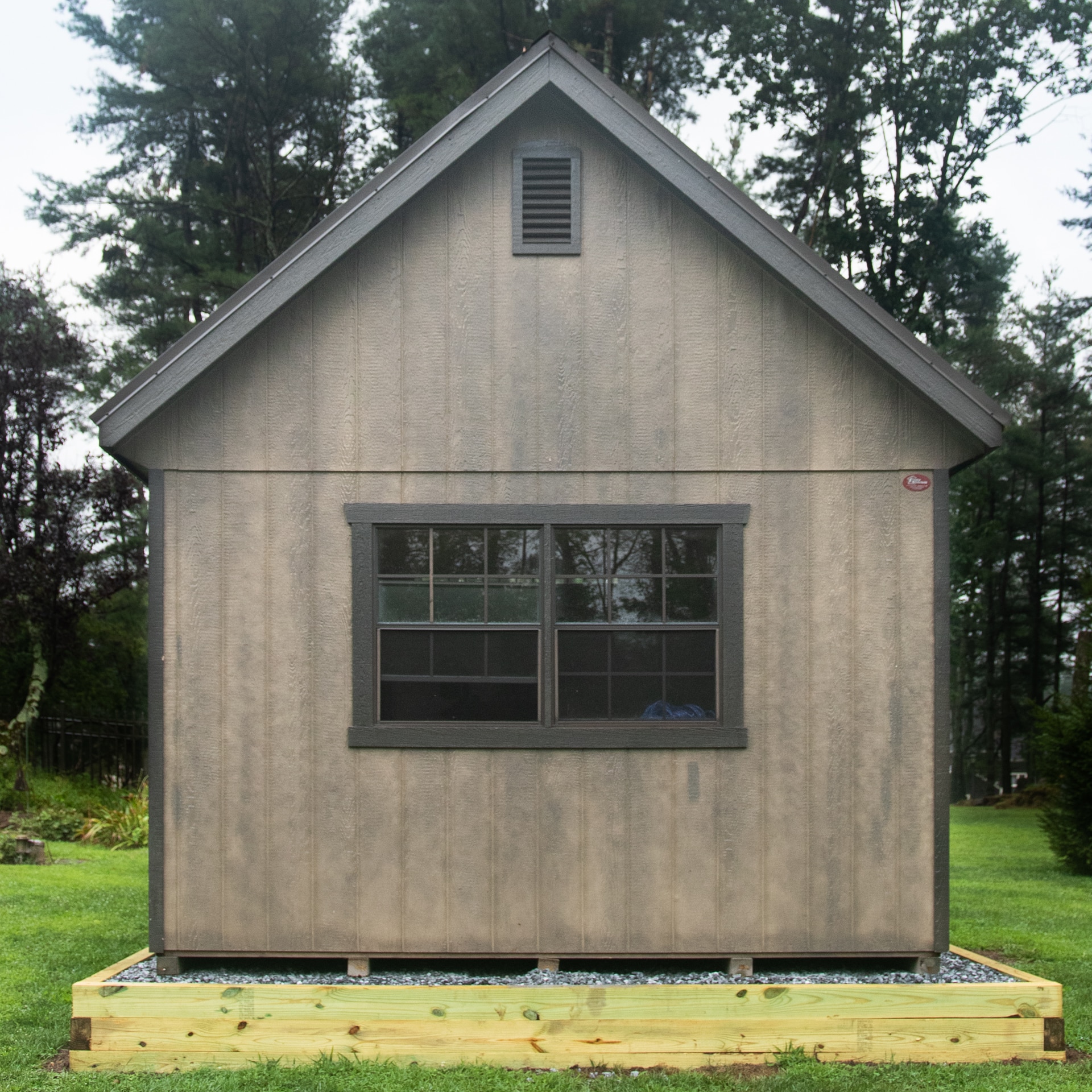 Gravel shed foundation with a shed