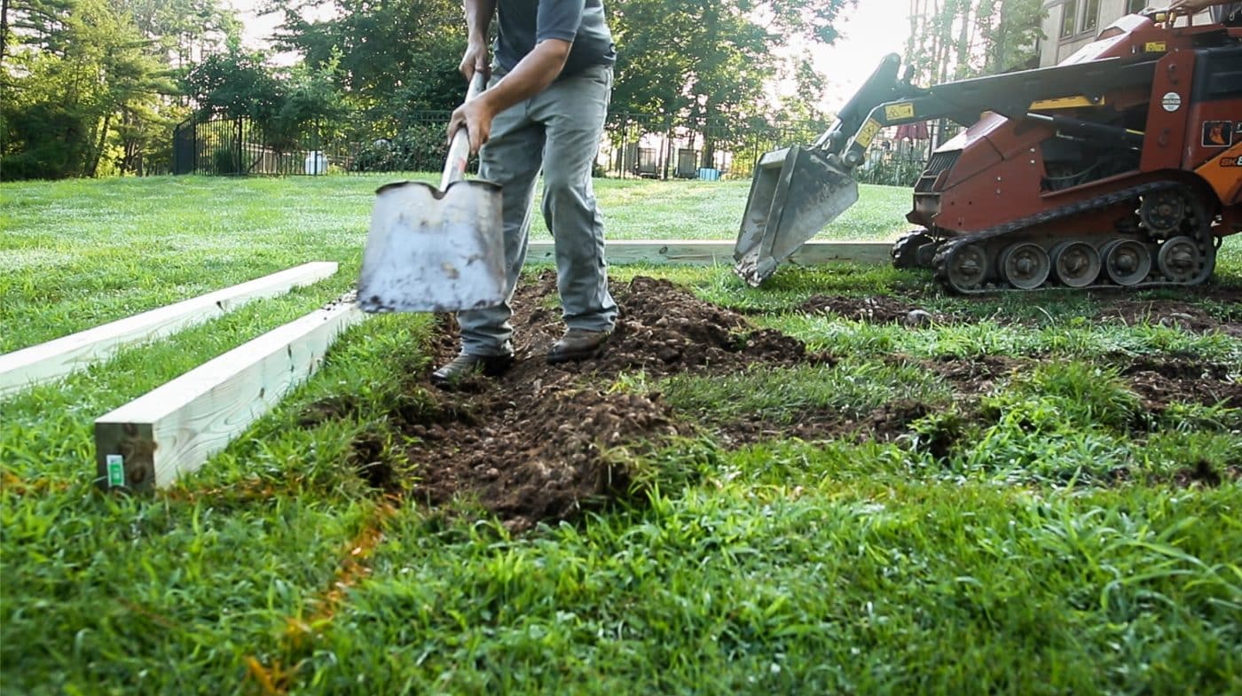 Digging ground to build a gravel shed foundation