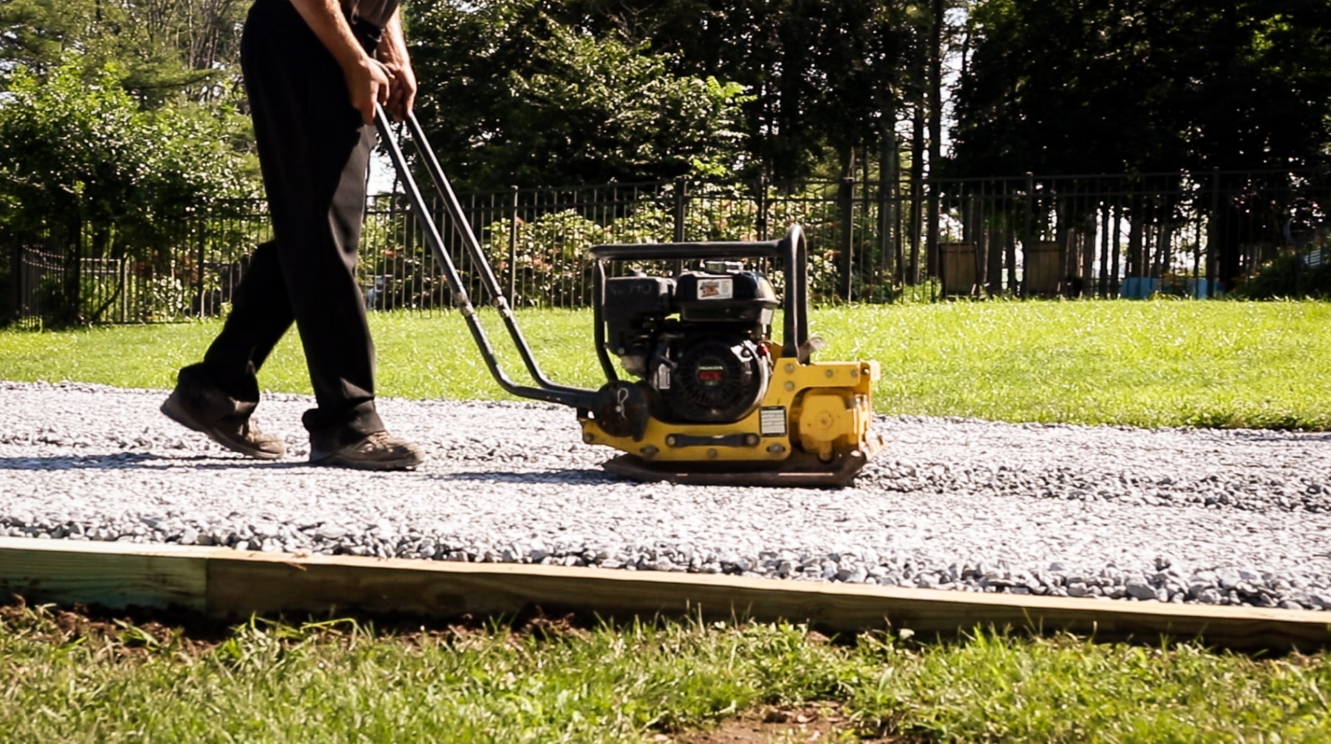 Compacting stone for a gravel shed foundation