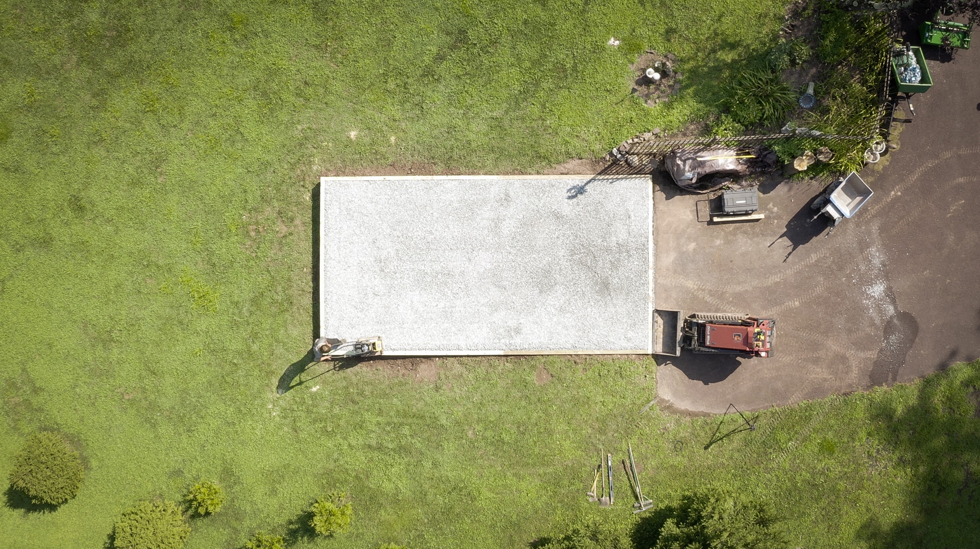 Tamping a gravel shed foundation during installation