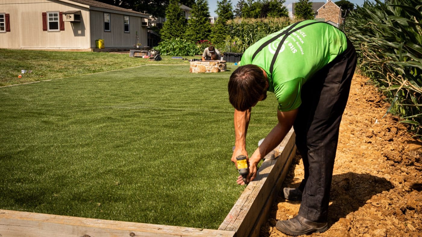 leveling ground for playset turf pad