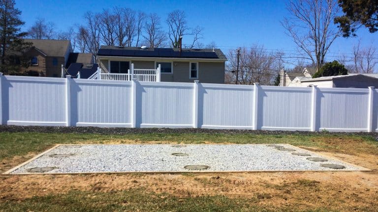 Shed foundation piers with anchors and a gravel pad