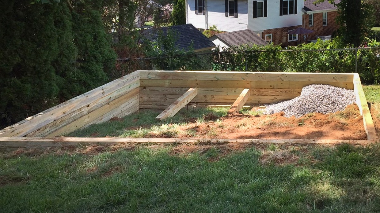 A site preparation company at work on a shed foundation