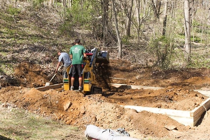 Workers building a gravel shed foundation in PA