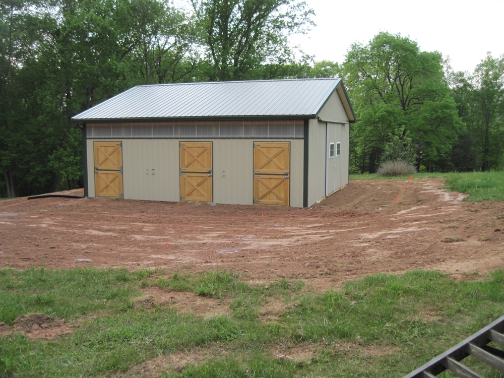 A horse barn with rubber stall mats